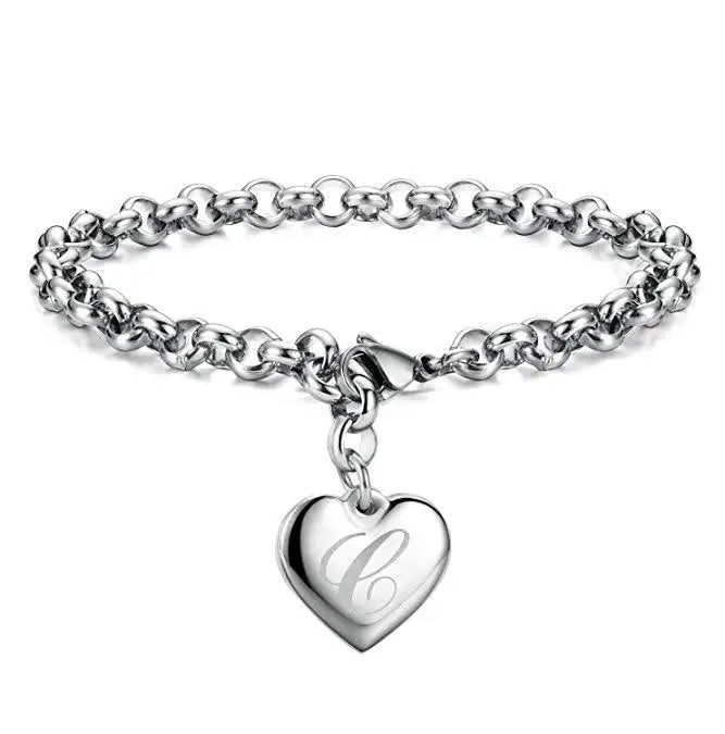 Silver bracelet with a heart-shaped charm on a white background.